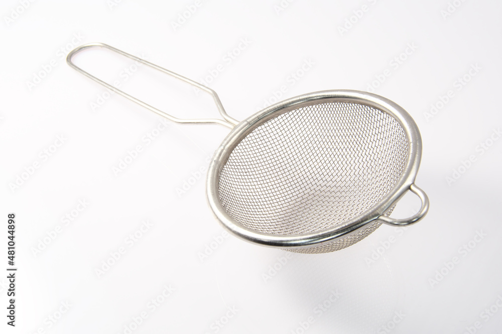 Colander with handle isolated on white background. Silver sieve Colander with handle isolated on white background. Silver sieve