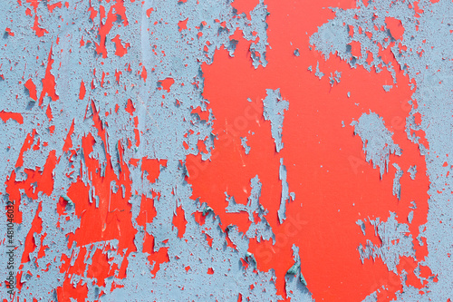 Closeup image showing the textures and colours of peeling paint
