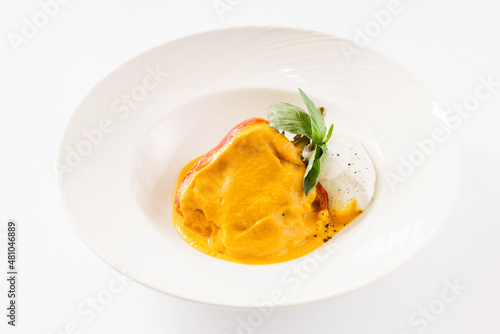 stuffed pepper with sauce, top view