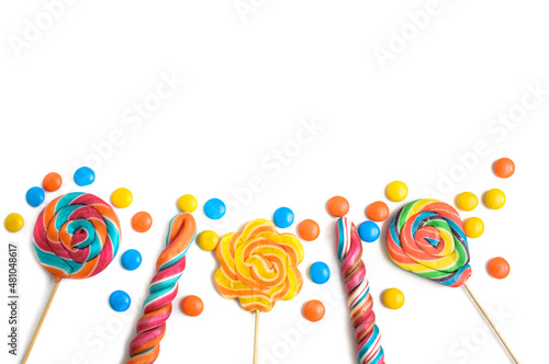 colored sticks and candy bars on a white background
