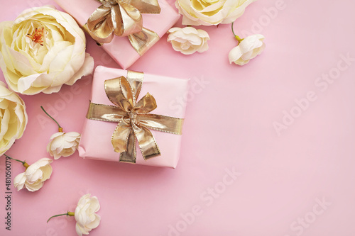 gift and flowers on pink background. best for valentines day  wedding  mothers day or birthday