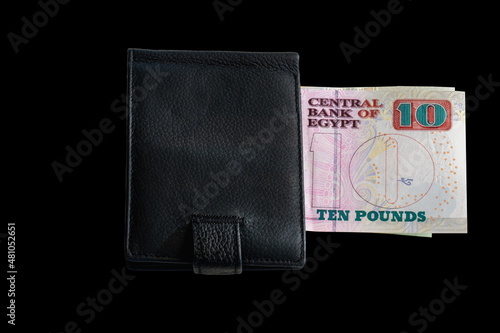 Wallet with 10 Egyptian pound bank note isolated on black background. photo