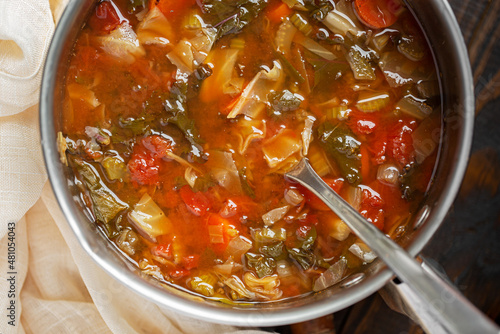 Overhead view of healthy cabbage vegetable soup in a pot