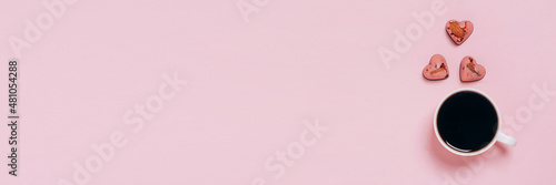 Chocolate candies hearts coffee cup pink background. Flat layout copy space. Holiday concept February 14 Valentine's Day