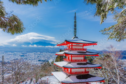 The Chureito Pagoda with the background of Mount Fuji during winter with cloud hat is cover