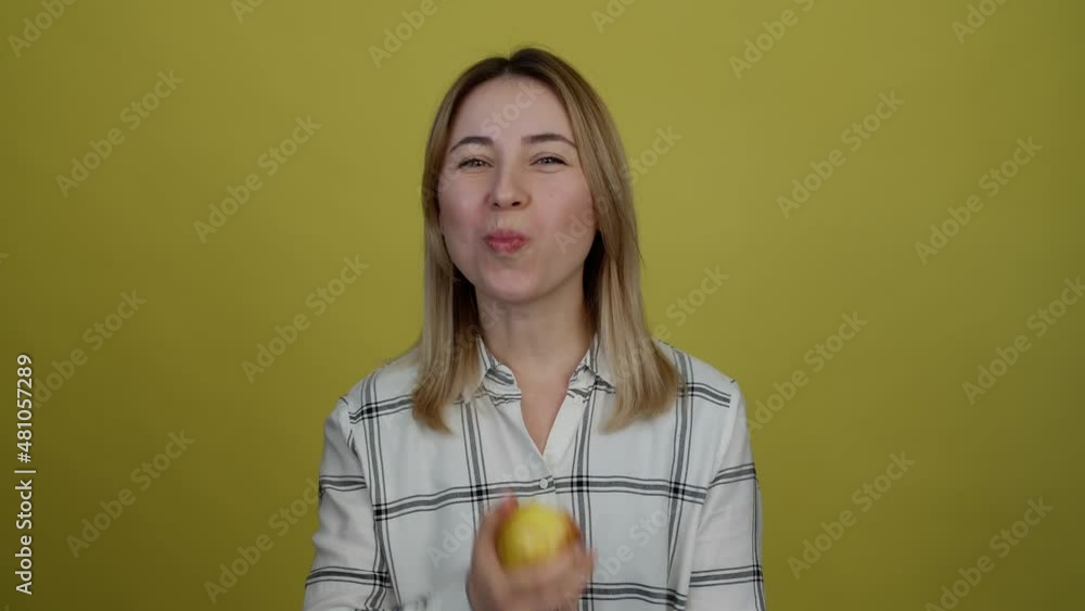 Close up portrait of girl biting and eating tasty red apple. Hungry woman with appetite biting juicy red apple, healthy snack. Girl with apples. diet nutrition food 4 K Close up portrait of girl biting and eating tasty red apple. Hungry woman with appetite biting juicy red apple, healthy snack. Girl with apples. diet nutrition food 4 K
