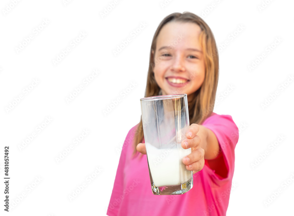 Teenager girl holds out a glass with milk isolated Teenager girl holds out a glass with milk isolated