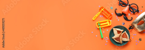 Beautiful composition for Purim celebration with space for text on orange background
