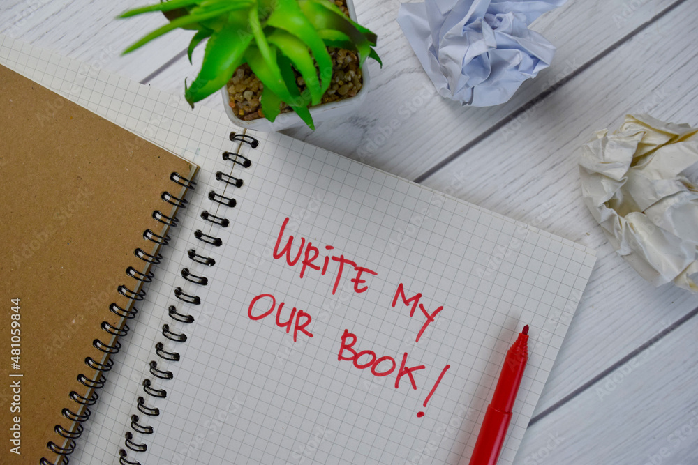 Write My Our Book write on a book isolated on Wooden Table. Write My Our Book write on a book isolated on Wooden Table.