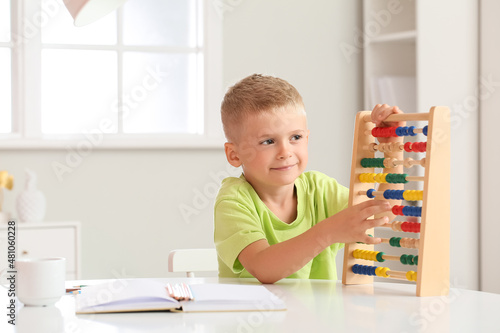 Adorable little boy learnin...