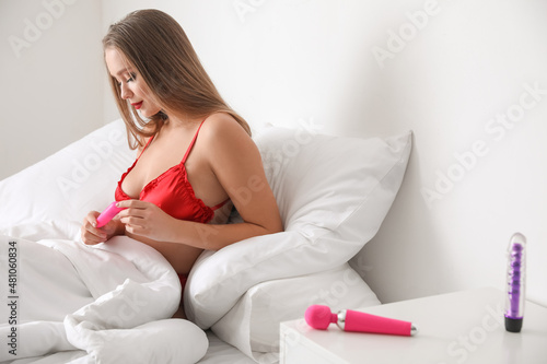 Sexy woman with vibrators i...