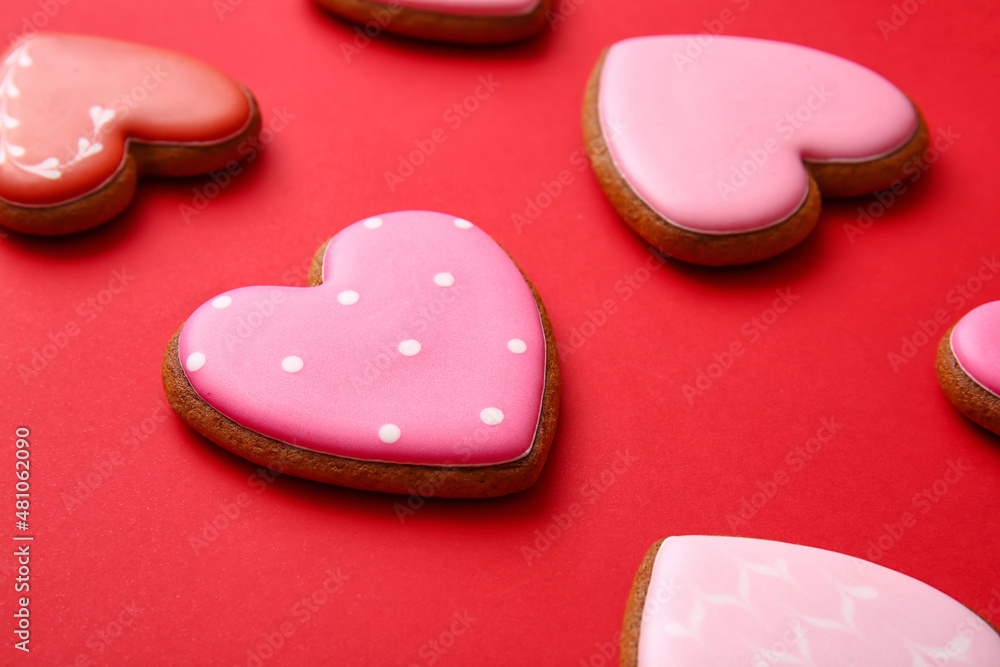 Tasty heart shaped cookies on red background Tasty heart shaped cookies on red background