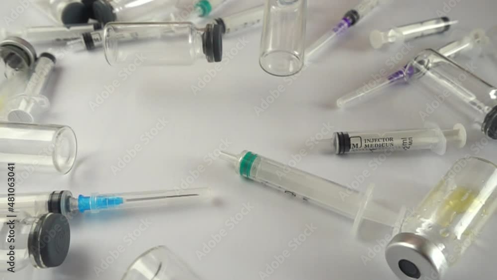 Syringes and falling ampoules. Slow motion. Syringes and falling ampoules. Slow motion.