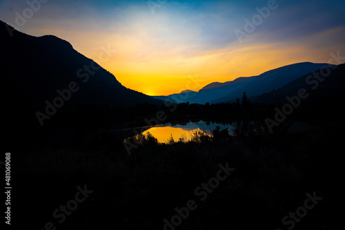 sunset over the lake in the mountains