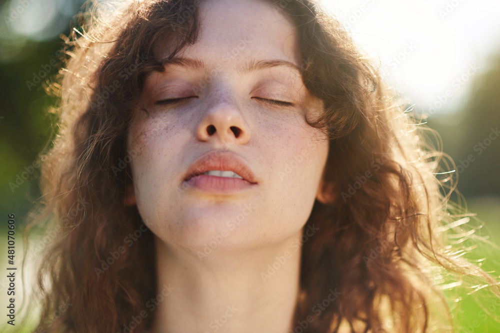 A portrait photo of a ginger girl with closed eyes A portrait photo of a ginger girl with closed eyes