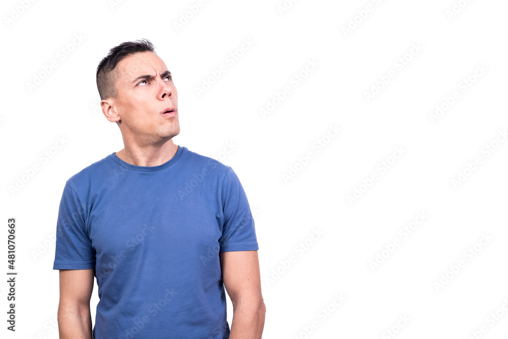 Portrait of a man looking up with expression of doubt Portrait of a man looking up with expression of doubt
