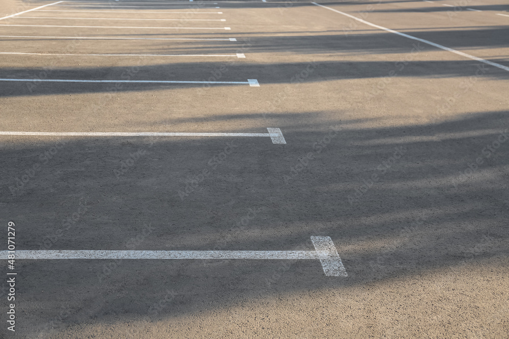 Empty parking lot with white marking lines Empty parking lot with white marking lines