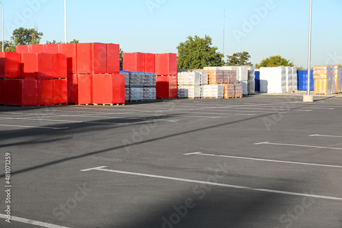 Fototapeta Naklejka Na Ścianę i Meble -  Empty parking lot near supermarket warehouse