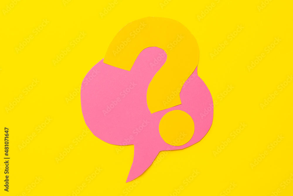 Question mark and speech bubble made of paper on yellow background Question mark and speech bubble made of paper on yellow background