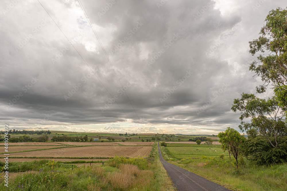 Australian country road with hay fields after harvest on either side Australian country road with hay fields after harvest on either side