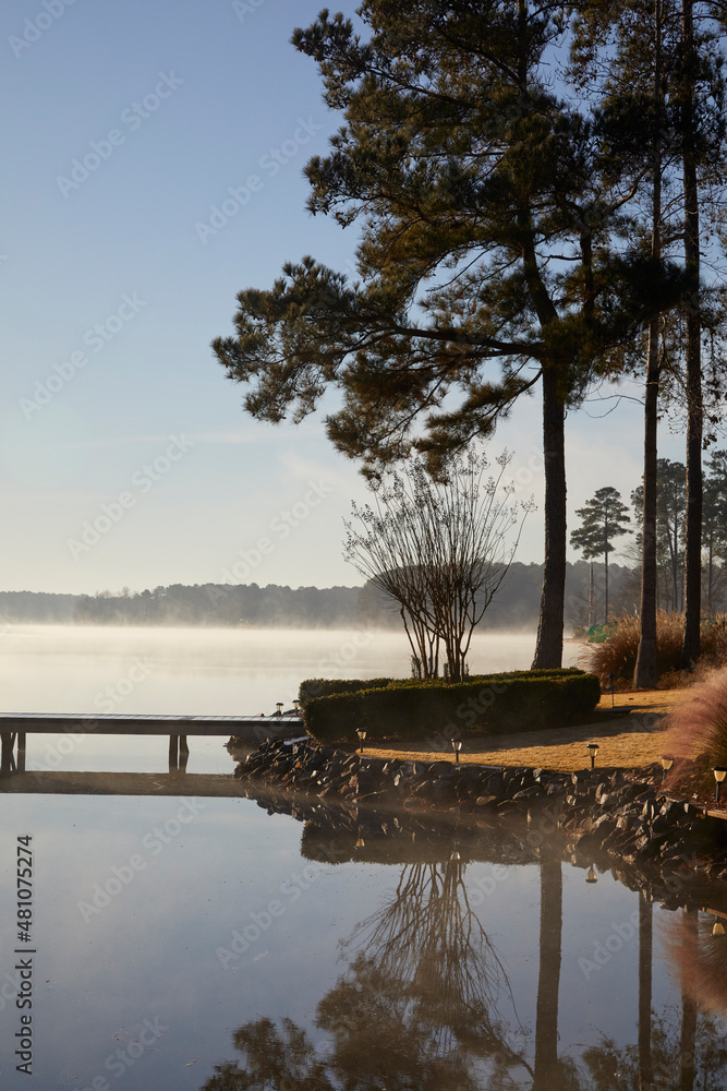 Calm lake without a ripple on a southern lake in Georgia USA Stock Photo |  Adobe Stock