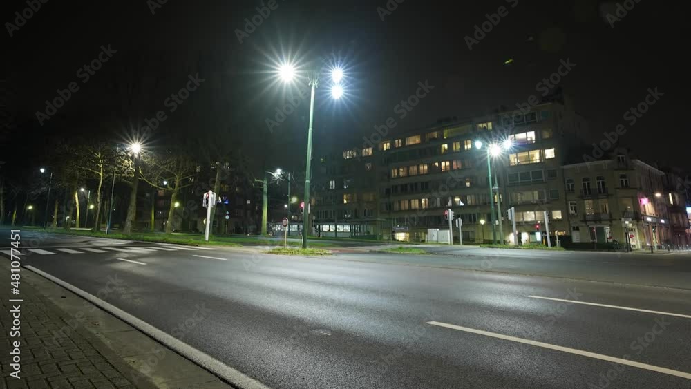 Timelapse Of Traffic Driving At The Busy Intersection At Night In Brussels, Belgium. Timelapse Of Traffic Driving At The Busy Intersection At Night In Brussels, Belgium.