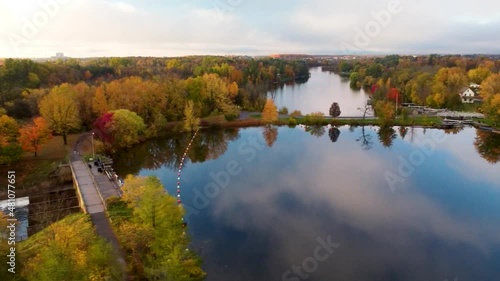 River drone shot over a river damn in the fall
