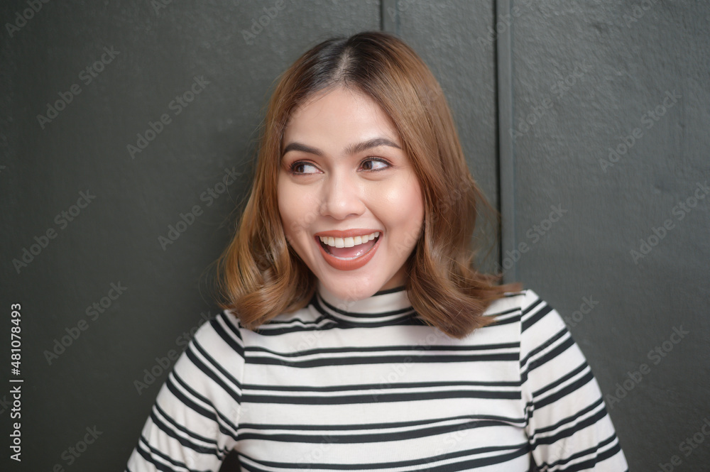 portrait of young beautiful short hair woman over black background portrait of young beautiful short hair woman over black background