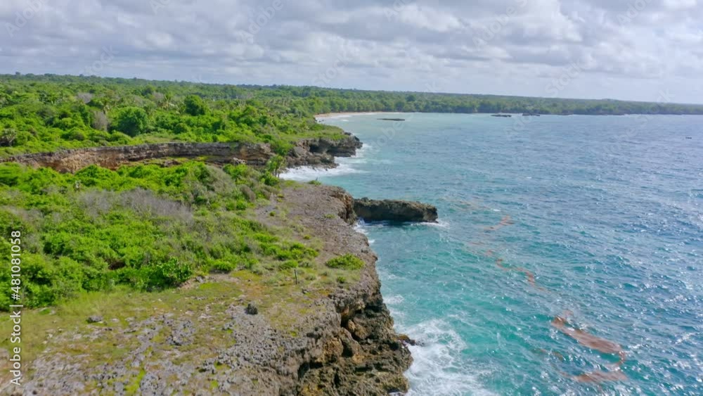 Waves Crashing On Rocky Cliffs In Boca de Yuma, Dominican Republic - aerial drone shot Waves Crashing On Rocky Cliffs In Boca de Yuma, Dominican Republic - aerial drone shot