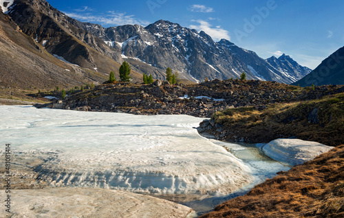 Ice on the river Arhat in june in Eastern Sayan