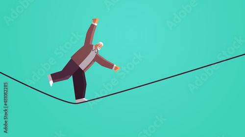 senior businessman walking on balancing tight rope risk challenge help in business concept horizontal