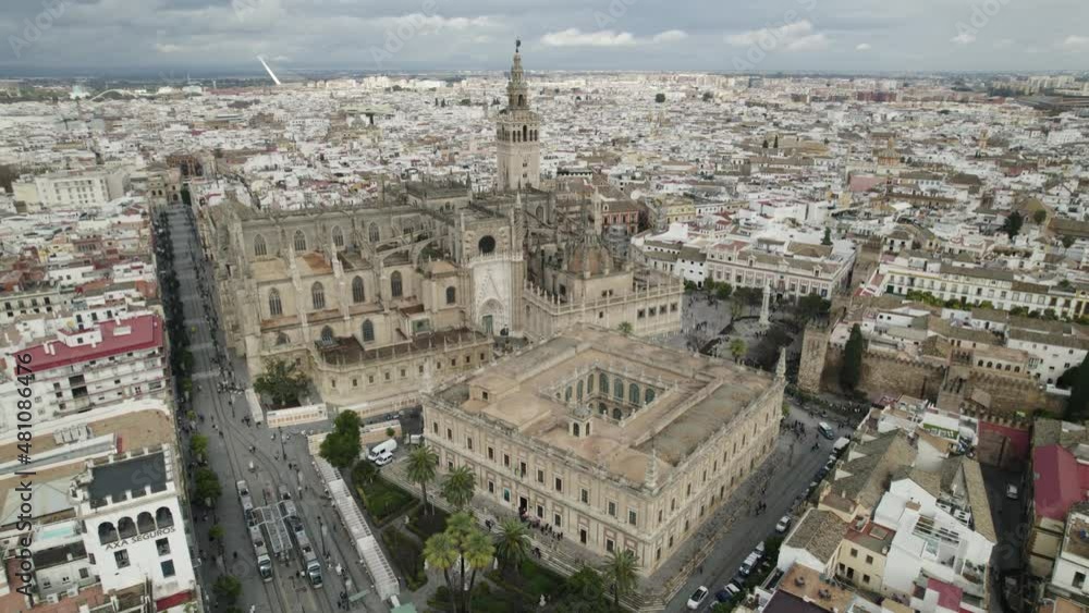 Stunning Seville Cathedral with distinctive Gothic architecture; aerial pan Stunning Seville Cathedral with distinctive Gothic architecture; aerial pan