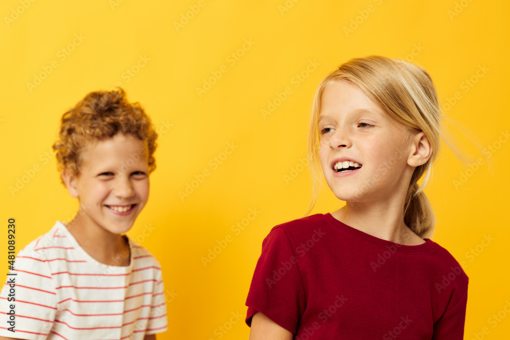 picture of positive boy and girl cuddling fashion childhood entertainment isolated background picture of positive boy and girl cuddling fashion childhood entertainment isolated background