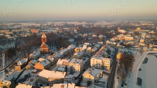 Beautiful Snow-Covered Rooftops In The Charming Town Of Gorowo Ilaweckie In Poland - aerial shot photo