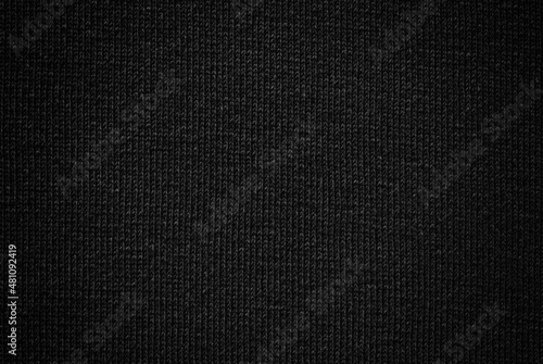 Black shaded wool knit pattern texture as background 