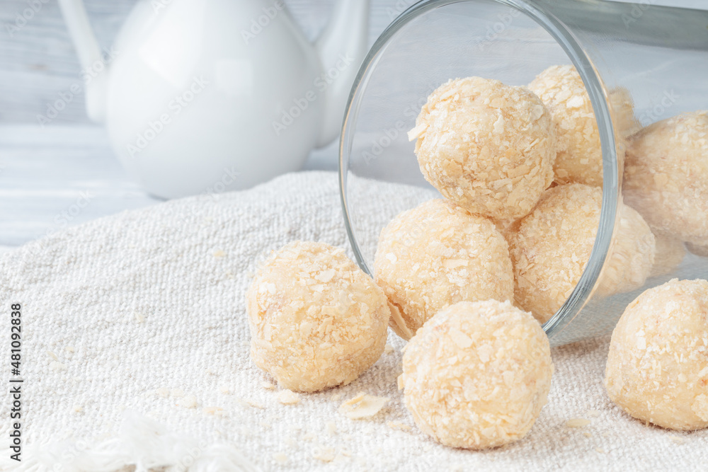 Close-up view of healthy raw paleo energy coconut balls. Soft focus. Close-up view of healthy raw paleo energy coconut balls. Soft focus.