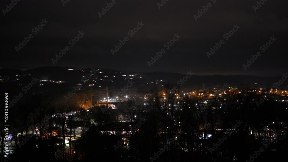 Mouintain top view of town, small city, suburbs, cars driving, carlights, 60fps for 23.976 fps timeline Mouintain top view of town, small city, suburbs, cars driving, carlights, 60fps for 23.976 fps timeline