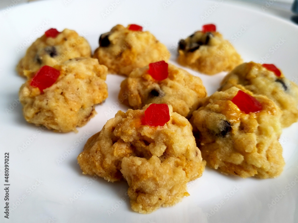 Red pearl biscuit. The main ingredients are flour, cornflakes, chocolate chips, and cherries. Cook in a hot oven. Red pearl biscuit. The main ingredients are flour, cornflakes, chocolate chips, and cherries. Cook in a hot oven.