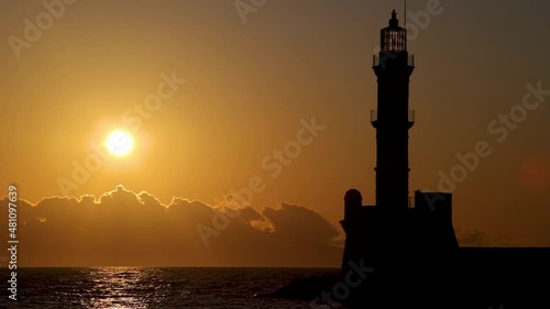 Magical sunset behind the lighthouse in Chania, Crete island, Greece