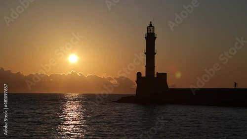 Magical sunset behind the lighthouse in Chania, Crete island, Greece