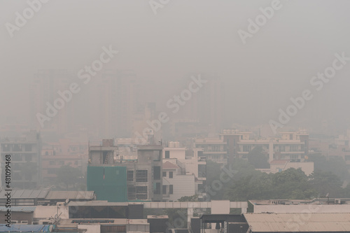 Air pollution over houses and apartment in the Indian city of Gurgaon. Poor air quality index leading to respiratory diseases. Toxic air for people in gurugram, Haryana, India.