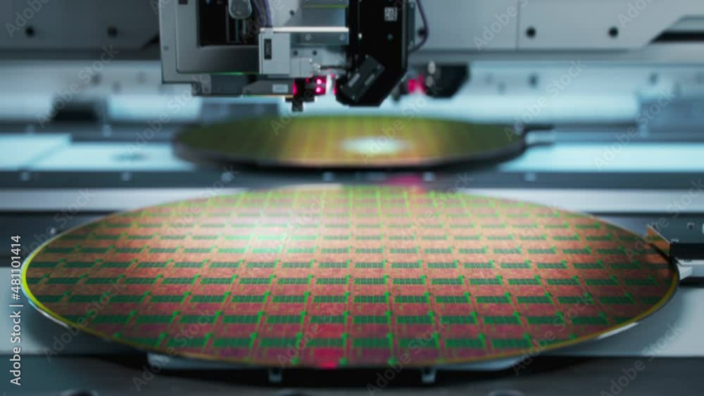 Shot of Silicon Wafer being processed at Semiconductor Foundry, that produces Computer Chips. Shot of Silicon Wafer being processed at Semiconductor Foundry, that produces Computer Chips.