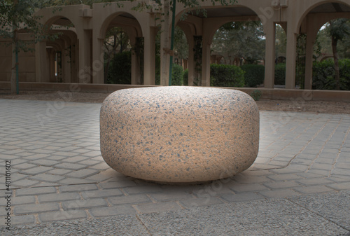 Picture of a unique stone in the middle of the park.