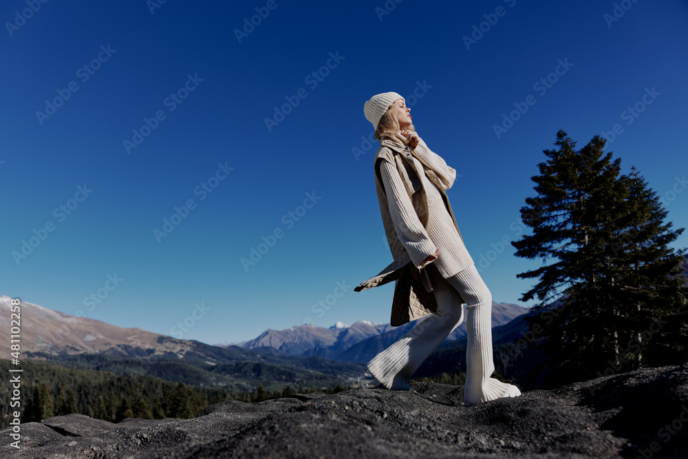 tourist Standing on the edge of a cliff nature travel lifestyle tourist Standing on the edge of a cliff nature travel lifestyle