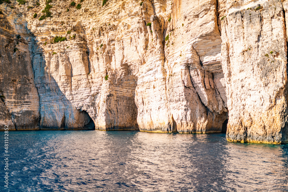White-stoned rocks creating cave in Corfu island sea beach