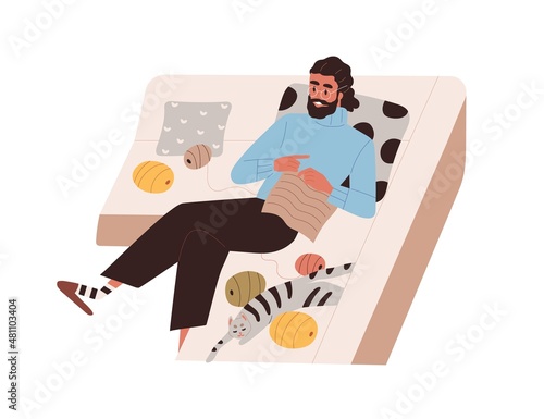 Person knitting at home. Crochet hobby. Man relaxing on sofa with yarn, needl...