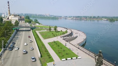 Russia, Irkutsk. Embankment of the Angara River, Monument to the Founders of Irkutsk. The text on the Russian - Irkutsk, Aerial View Hyperlapse photo