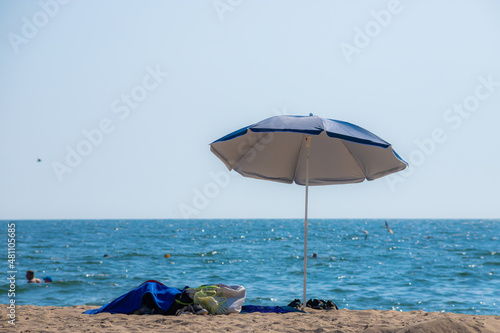 Parasols sunbed beach clouds turquoise sea.Panorama colorful umbrellas white sandy sunlight