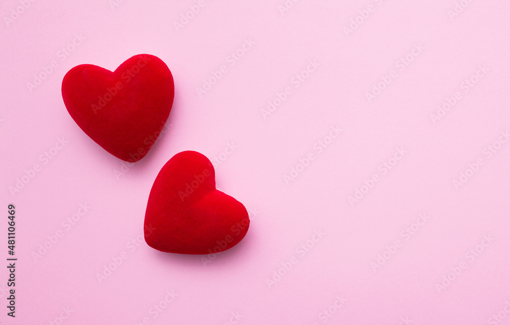 Valentine's Day. Love background. Gifts in the form of hearts on a pink background with the inscription love. Copy space for text. The concept of romance and love. Valentine's Day. Love background. Gifts in the form of hearts on a pink background with the inscription love. Copy space for text. The concept of romance and love.