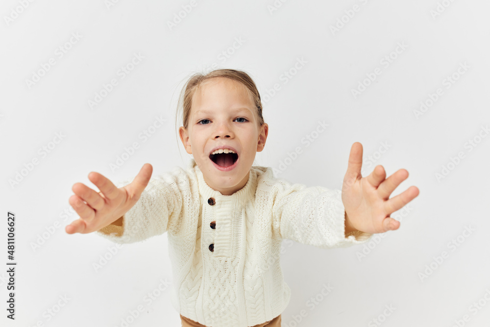 Portrait of happy smiling child girl baby clothes fashion light background Portrait of happy smiling child girl baby clothes fashion light background
